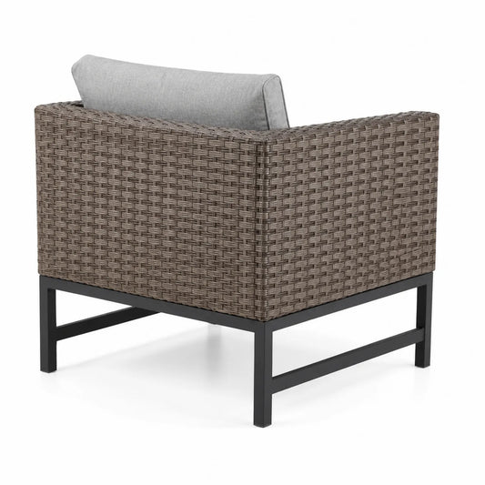 Poltrona da esterno in rattan con cuscino grigio